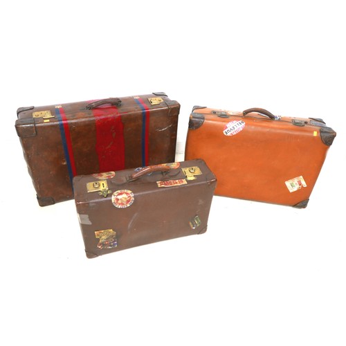 309 - Three vintage fibre suitcases with interesting labels. (3)