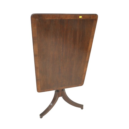 503 - An oak and mahogany tilt top side table on tripod base, 82 by 54 by 73cm high.