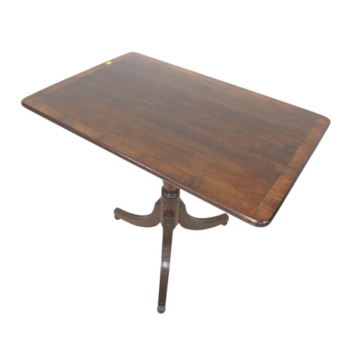 503 - An oak and mahogany tilt top side table on tripod base, 82 by 54 by 73cm high.