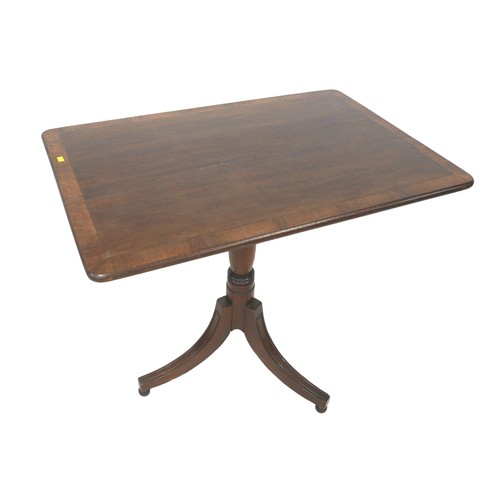 503 - An oak and mahogany tilt top side table on tripod base, 82 by 54 by 73cm high.