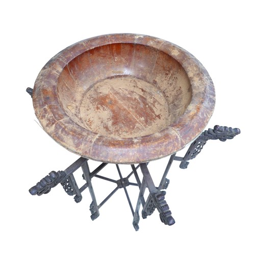 253 - A Chinese carved wooden folding stand with associated bowl, 67 by 86 cm.