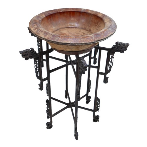 253 - A Chinese carved wooden folding stand with associated bowl, 67 by 86 cm.