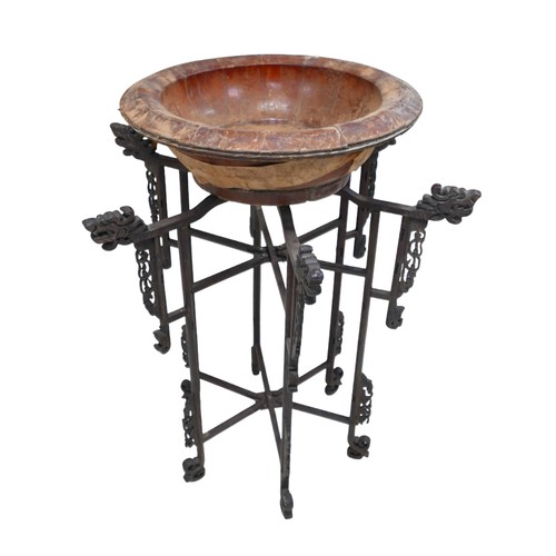 253 - A Chinese carved wooden folding stand with associated bowl, 67 by 86 cm.