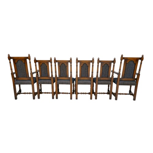 551 - A set of six Titchmarsh & Goodwin oak dining chairs, including two carvers, all with padded backrest... 