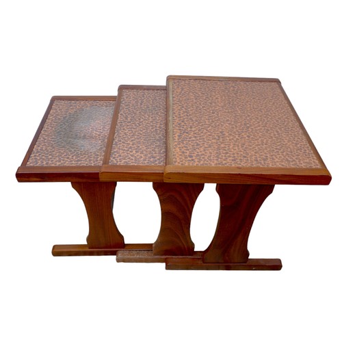 476 - A nest of three G-Plan side tables with textured copper tops, largest 52 by 4.5 by 48cm high. (3)