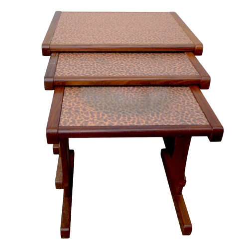 476 - A nest of three G-Plan side tables with textured copper tops, largest 52 by 4.5 by 48cm high. (3)