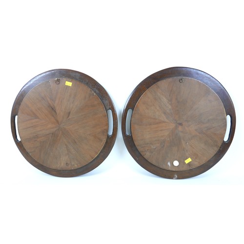 252 - A pair of Edwardian marquetry inlaid bread platters / trays, each 37cm diameter. (2)