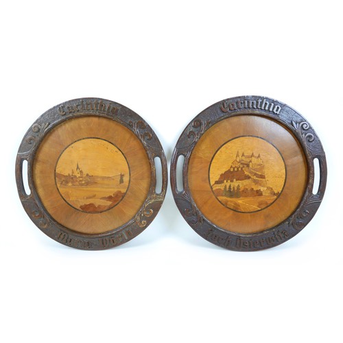 252 - A pair of Edwardian marquetry inlaid bread platters / trays, each 37cm diameter. (2)