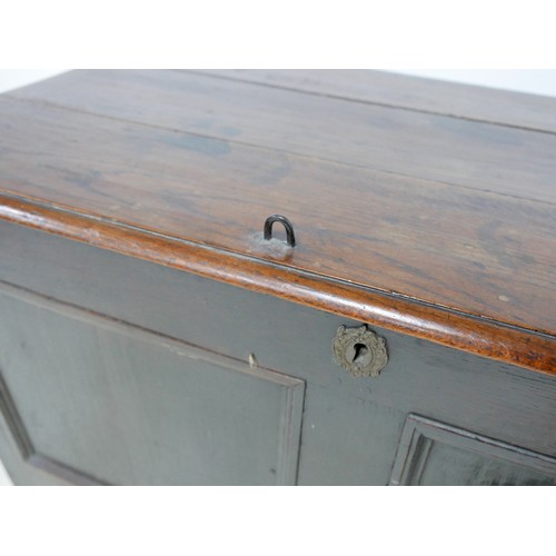 606 - An 18th century oak mule chest, two panel front, ring hinges, raised on stile feet, 112 by 60 by 86c... 