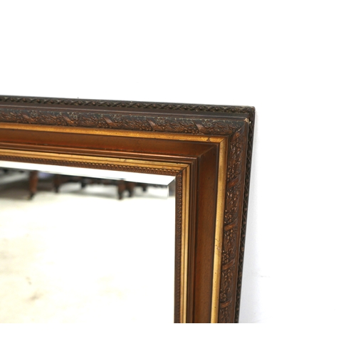 487 - An Edwardian wall mirror, with rectangular bevelled plate, and gilt frame, 86 by 7 by 60cm.