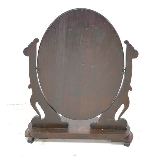 485 - A Victorian mahogany toilet mirror, oval swing plate, shaped base, 67 by 31 by 80cm high.