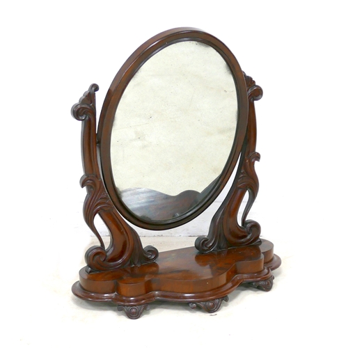 485 - A Victorian mahogany toilet mirror, oval swing plate, shaped base, 67 by 31 by 80cm high.