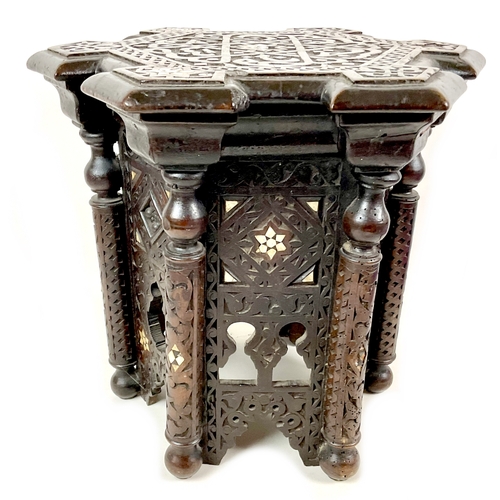 249 - A Persian hexagonal side table, low relief carved decoration inlaid with mother-of-pearl, 40 by 35 b... 