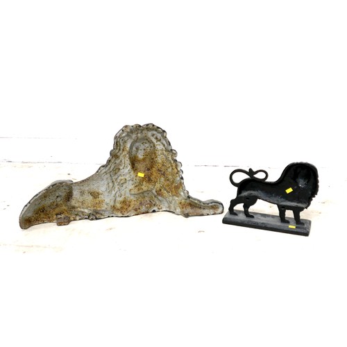 338 - A cast iron figure, in the form of a recumbent lion, 65 by 36cm high, together with a cast iron door... 