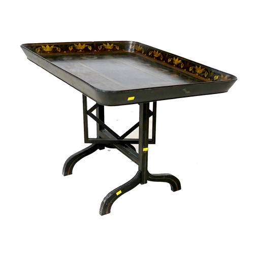 518 - A Victorian ebonised and gilt painted work tray top side table, the tray surface decorated with a fl... 