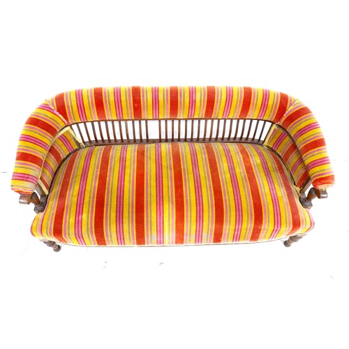 522 - A late Victorian two seater settee, upholstered in red and orange striped fabric, 133 by 62 by 85cm ... 