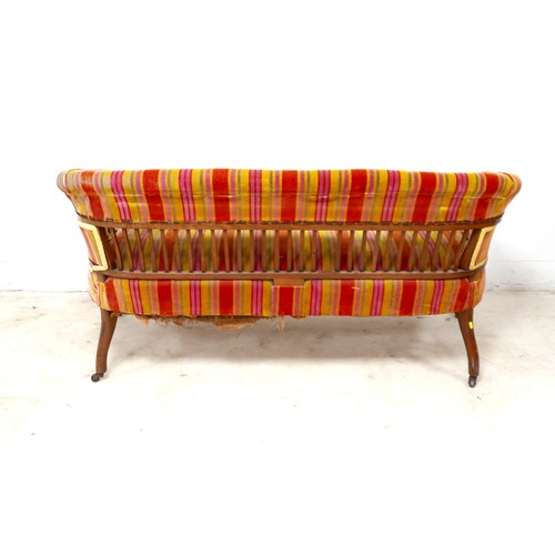 522 - A late Victorian two seater settee, upholstered in red and orange striped fabric, 133 by 62 by 85cm ... 