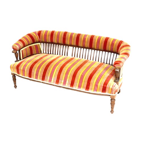 522 - A late Victorian two seater settee, upholstered in red and orange striped fabric, 133 by 62 by 85cm ... 