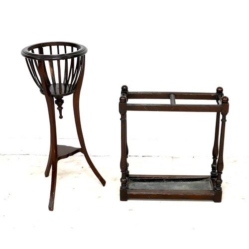 512 - An Edwardian mahogany jardiniere stand, 36 by 90cm high, together with an oak stick stand with metal... 