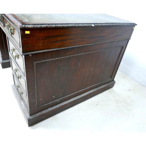 548 - An Edwardian mahogany twin pedestal partners desk, with a leather inset top above nine drawers, oppo... 