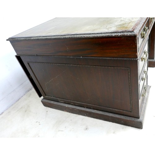 548 - An Edwardian mahogany twin pedestal partners desk, with a leather inset top above nine drawers, oppo... 