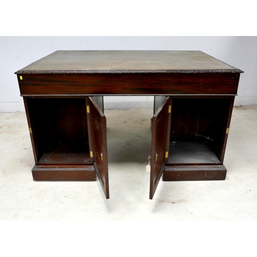 548 - An Edwardian mahogany twin pedestal partners desk, with a leather inset top above nine drawers, oppo... 