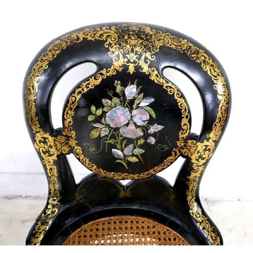 550 - A Victorian ebonised side chair, inlaid with mother of pearl and decorated with scrolling gilt borde... 