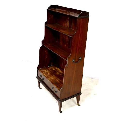 565 - An Edwardian mahogany waterfall bookcase, with a drawer to base, 62 by 31 by 117cm high.

Provenance... 