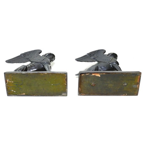 129 - A pair of Victorian cast iron sculptures, modelled as sphinx figures, on rectangular bases, unsigned... 