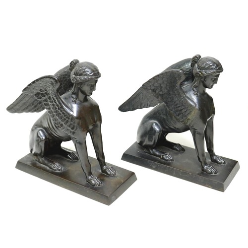 129 - A pair of Victorian cast iron sculptures, modelled as sphinx figures, on rectangular bases, unsigned... 