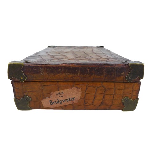 312 - An early 1900s crocodile attache case with a fitted interior, 36cm by 23cm by 9.5cm tall