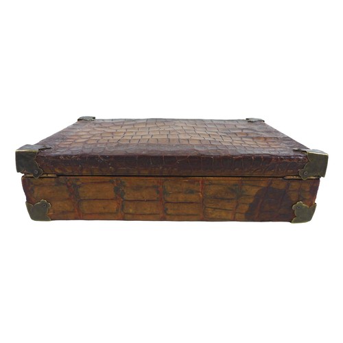 312 - An early 1900s crocodile attache case with a fitted interior, 36cm by 23cm by 9.5cm tall