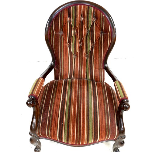 534 - A Victorian style fireside button back open armchair with jazz striped material, 64 by 78 by 89cm hi... 