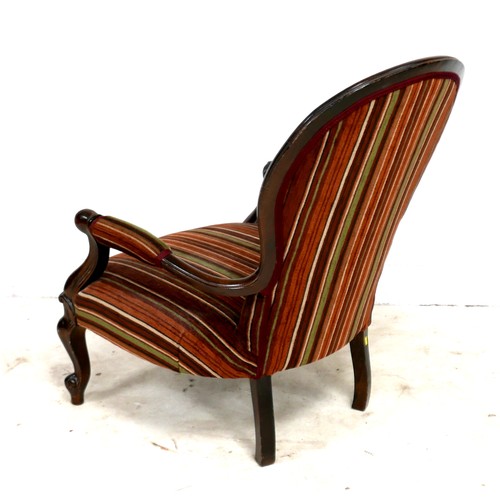 534 - A Victorian style fireside button back open armchair with jazz striped material, 64 by 78 by 89cm hi... 