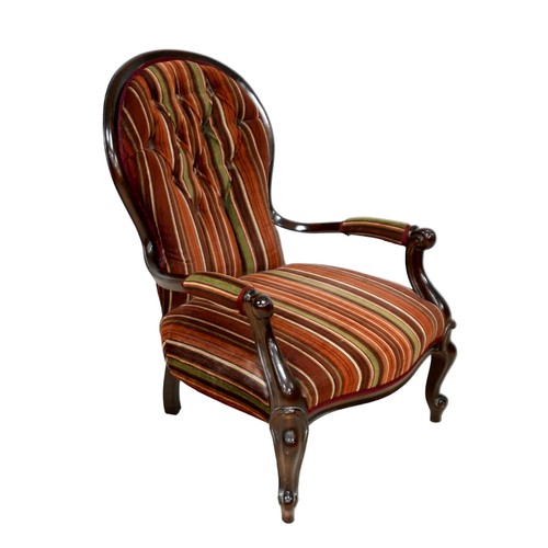 534 - A Victorian style fireside button back open armchair with jazz striped material, 64 by 78 by 89cm hi... 