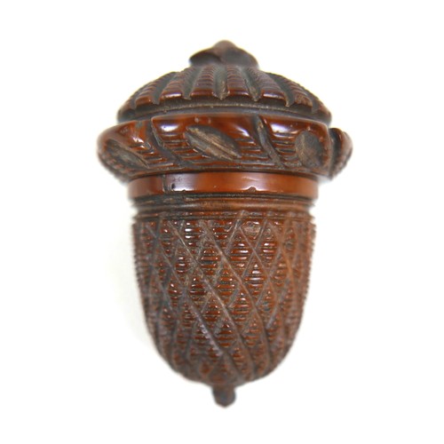 256 - A 19th century carved treen nutmeg grater and a treen eggcup, the grater measures 4.5cm by 6.5cm and... 