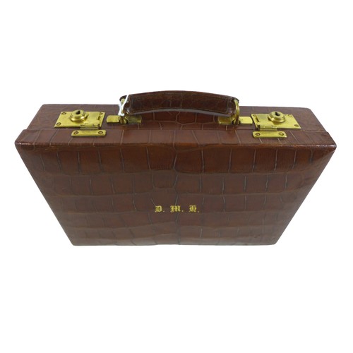 321 - Property of a Gentleman: a good quality crocodile leather attache case, with a fitted interior and b... 