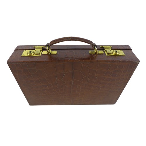 321 - Property of a Gentleman: a good quality crocodile leather attache case, with a fitted interior and b... 