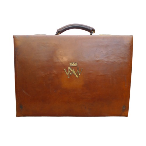 316 - A good quality early 1900's tan leather suitcase with a crown and initialled WWN, part fittings, als... 