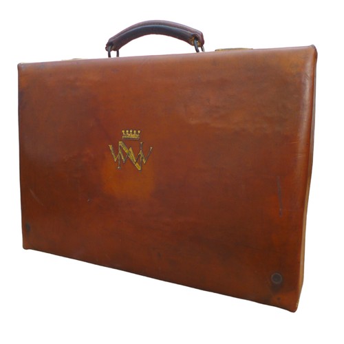 316 - A good quality early 1900's tan leather suitcase with a crown and initialled WWN, part fittings, als... 