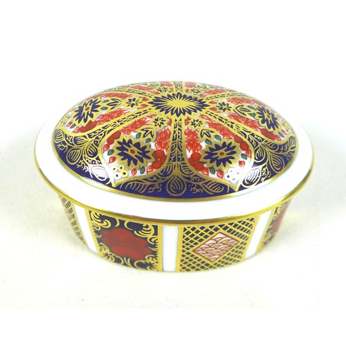 162 - A Royal Crown Derby china oval lidded box and pen tray, decorated in the Imari pattern. (2)