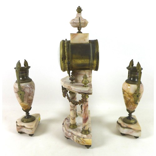 228 - A French pink marble portico clock garniture set, the clock 44cm tall, striking on a bell.