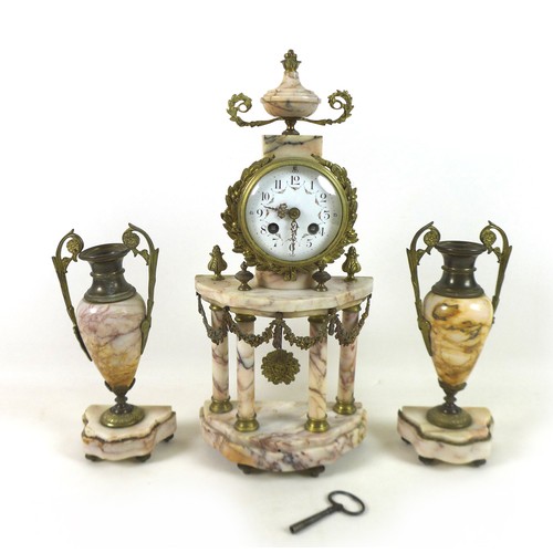 228 - A French pink marble portico clock garniture set, the clock 44cm tall, striking on a bell.