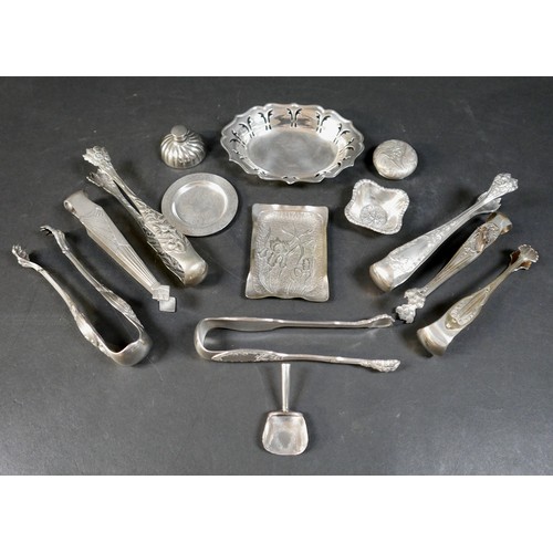 216 - A collection of fourteen pieces of white metal/plated items, including seven sugar nips. (1 bag)