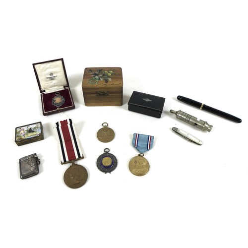 155 - A small group of collectables, including a silver vesta case, a silver medallion fob, cased, a silve... 