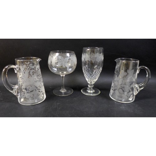 66 - A group of four clear glass 19th century presentation vases / goblets, comprising one tall clear gob... 