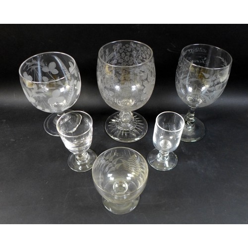 67 - A group of three clear glass 19th century presentation vases / goblets, comprising one engraved deco... 