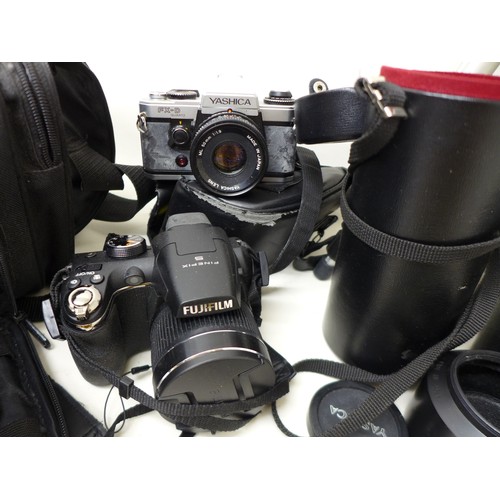 238 - Photographic interest: a quantity of assorted cameras and accessories, including EOS Canon 650 SLR, ... 