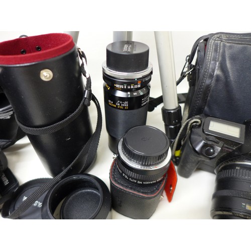 238 - Photographic interest: a quantity of assorted cameras and accessories, including EOS Canon 650 SLR, ... 