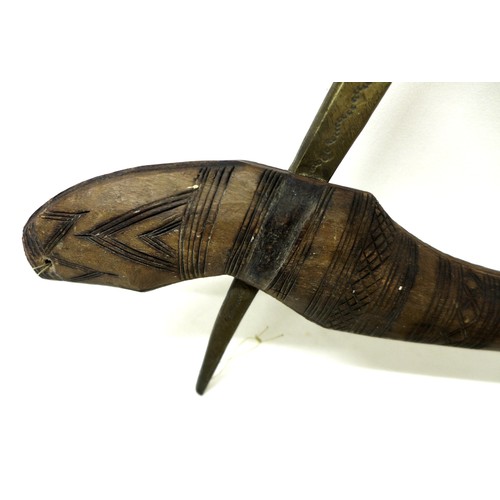 289 - Ethnographic / Tribal interest: a brass bladed African adze, the hardwood haft handle carved with in... 